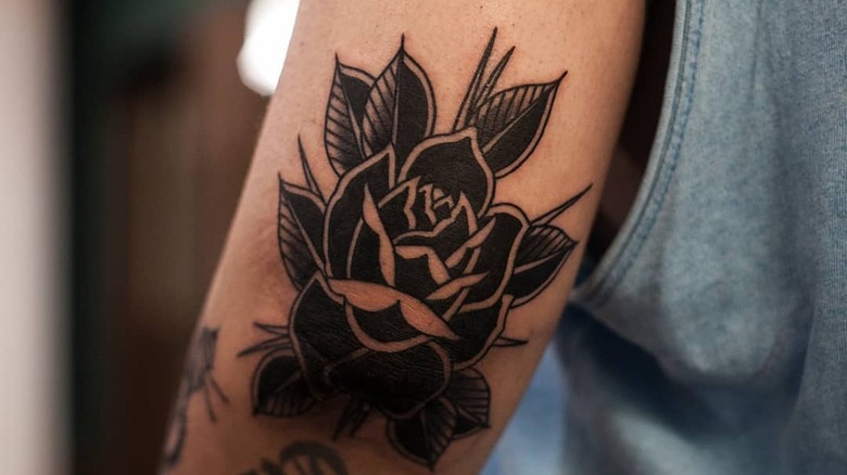 What does a black fist tattoo mean?  - N°1 Official Stars &  People Magazine, Wiki, Biography & News
