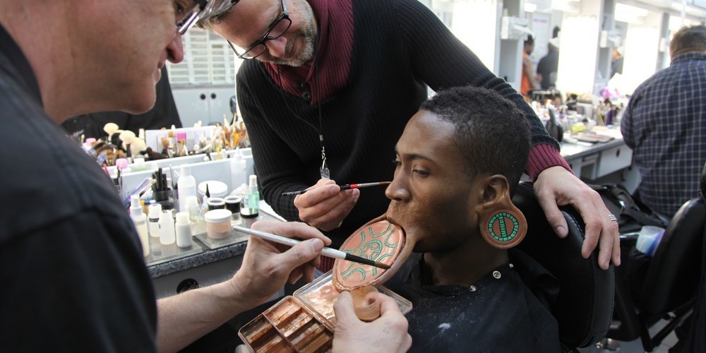 What does the Wakandan lip tattoo say?