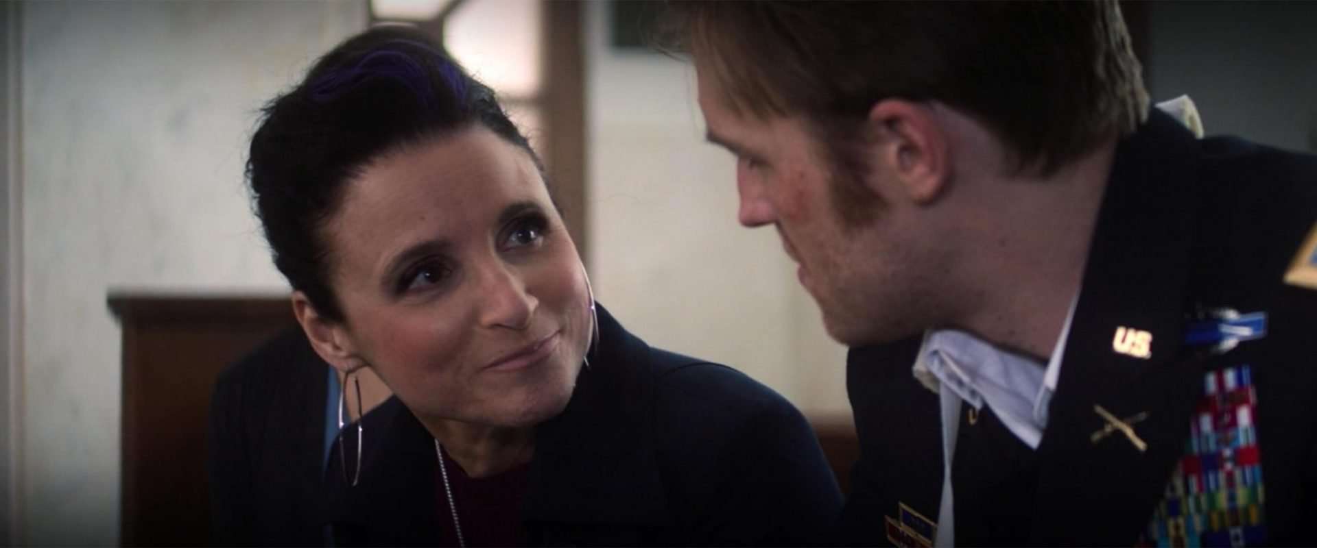 Who is the lady talking to John Walker?